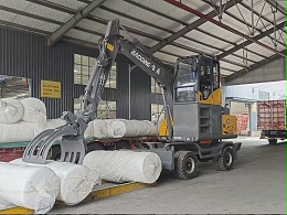 定制升降驾驶室，宝鼎95-9GS抓包机助力工厂物料搬运