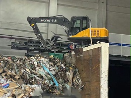 墙体安装式宝鼎电动抓料机在垃圾装卸中的应用